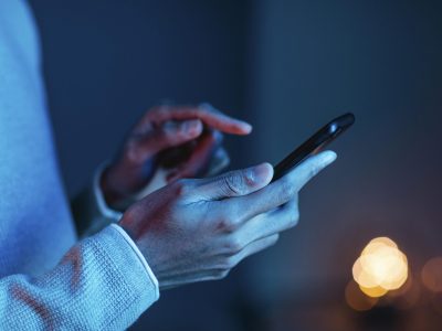 side-view-of-man-using-smartphone
